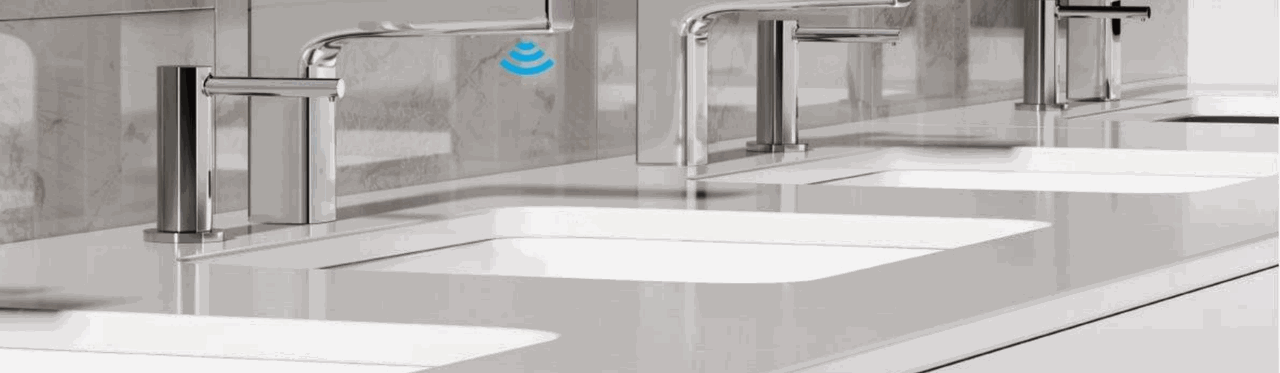 Polished chrome touchless sensor faucets with commercial sinks